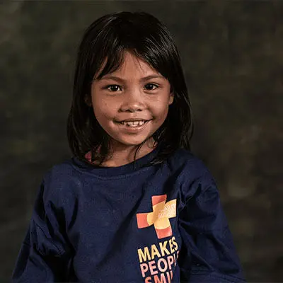 Filipino girl wearing a charity T-shirt