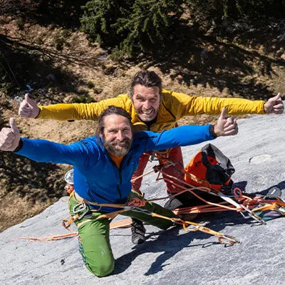 Thomas and Alexander Huber pose while climbing