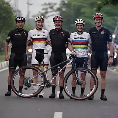 The corratec MTB Racing Team poses with a corratec bike